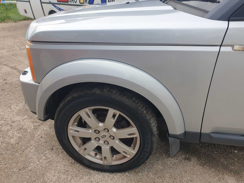 Bandou Ornament Overfender de pe Aripa Stanga Fata Fara Bandou Land Rover Discovery 3 L319 2004 - 2009 Culoare 798 Zermatt Silver [K5323]