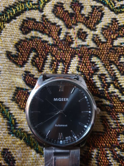 Часы фирмы MIGEER.