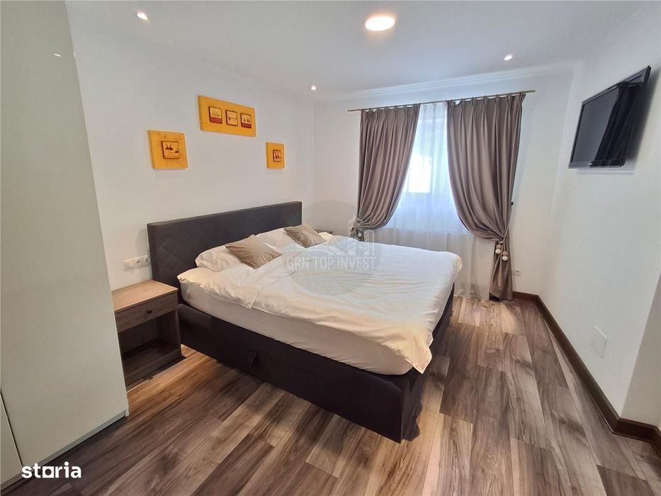 Casa individuala 4 camere 4 bai 250mp curte zona Piata Cluj