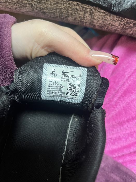 Nike Air Max Plus in the black and University Blue colorway.