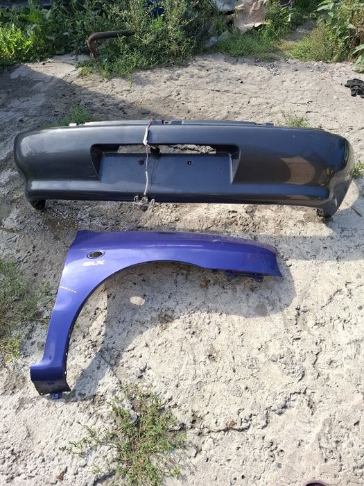 Задний бампер Мазда 121