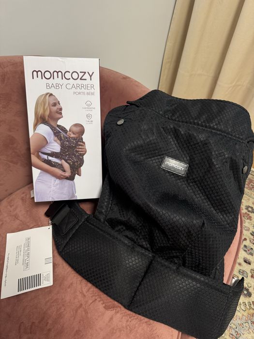 Momcozy Ергономична раница за бебета.