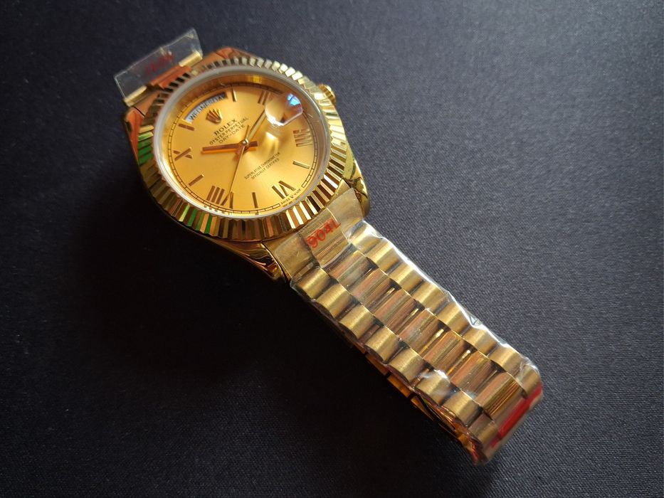 Rolex  Submariner, Day-Date Gold