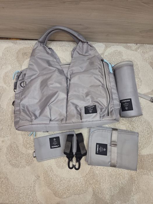 Lassig: Практична бебешка чанта за количка