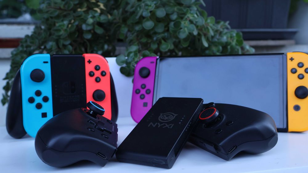 Nintendo Switch OLED – пълен комплект + 2 чифта оригинални Joy-Con + NYXI Hyperion Pro