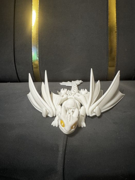 Подвижная игрушка дракон