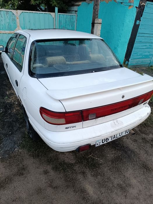 Автомобиль киа сепия