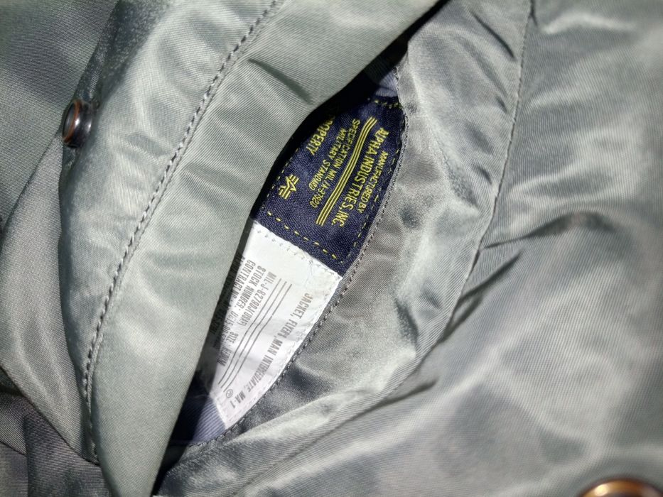 Alpha Industries MA-1 silver jacket.