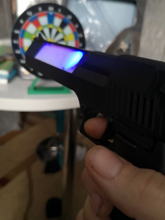 Пистолет лазер с мешенью  музыкалтной