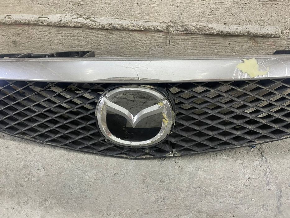 Решетка Мазда 323 птичка
