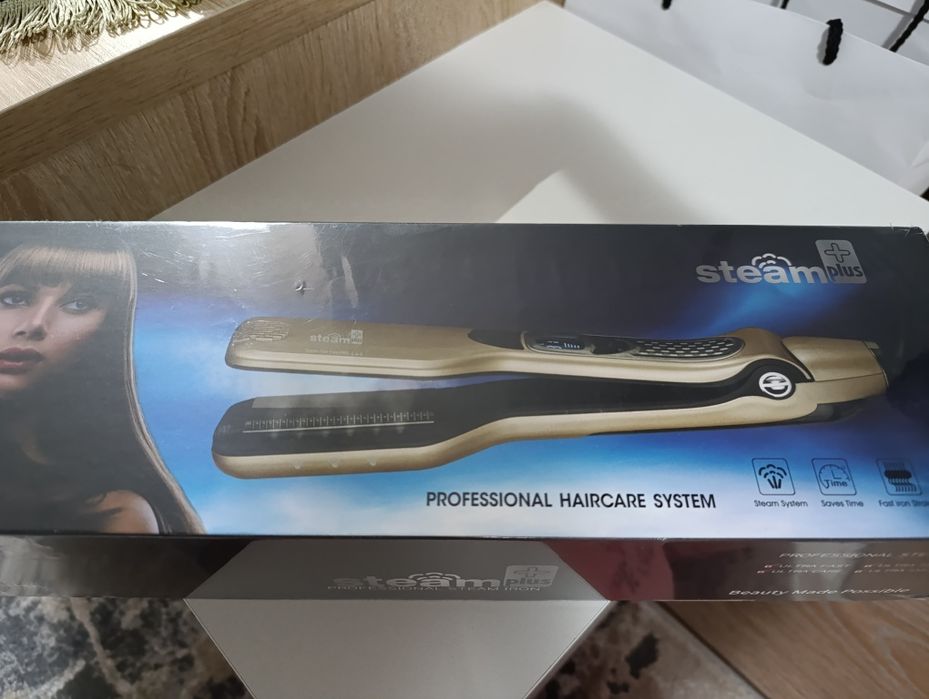 Placă de îndreptat părul cu aburi