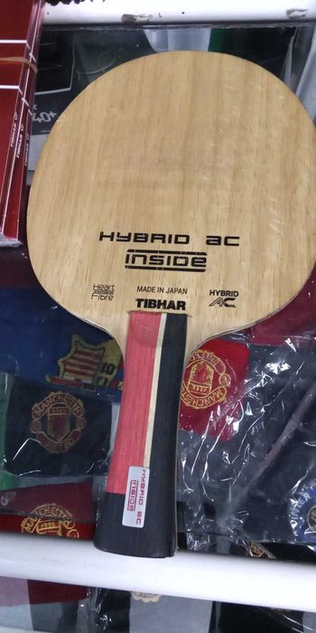 гуми за тенис на маса и дърво тибхар