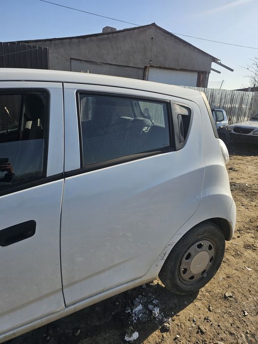 Dezmembrez  Chevrolet spark 2012 piese motor cutie uși haion aripi