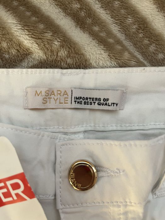 Дамски бели дънки над коляно