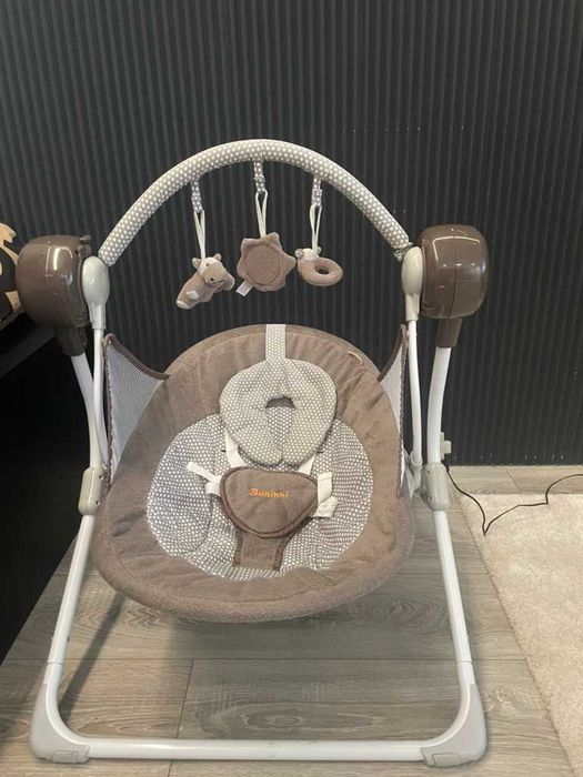 Leagan electric bebelusi Bakhini cu muzica si jucarii
