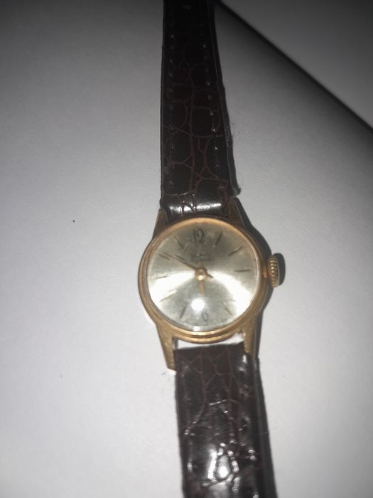 Продам позолоченые часы .