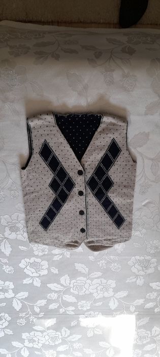 Жилетка за тысячу тг..