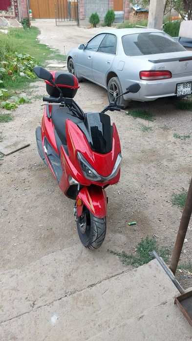 Макси скутер тоё.