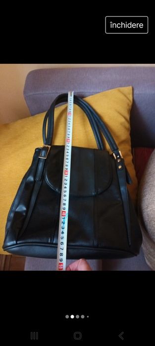 Vand geanta neagra de piele