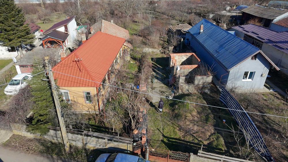 Vând proprietate în Comana: teren 1.974 mp, cu 21 m deschidere la stradă