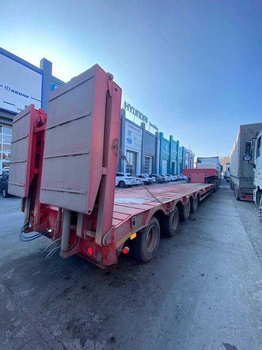 Полуприцеп тяжеловоз низкорамный Feilida-60т Tral podushka Orient Ozod