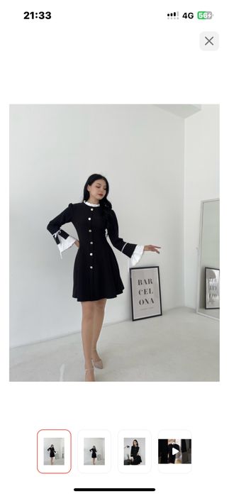 Стильное черное платье с белыми манжетами