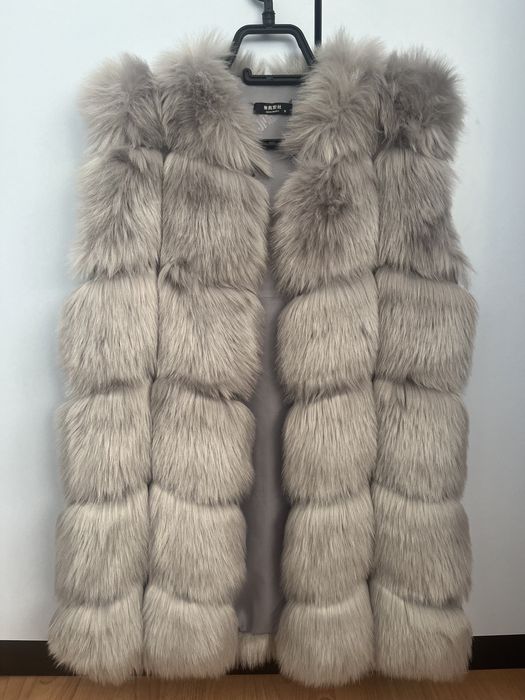 Дамски пухени елеци