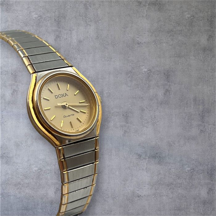 Doxa дамски швейцарски часовник с позлата