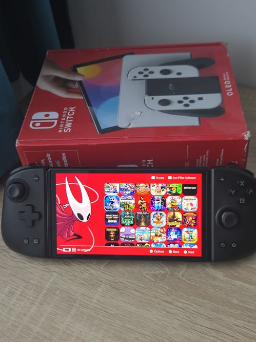 Nintendo Switch OLED Modat 512 gb + 74 Jocuri + Mobapad M6 HD – Stare excelentă