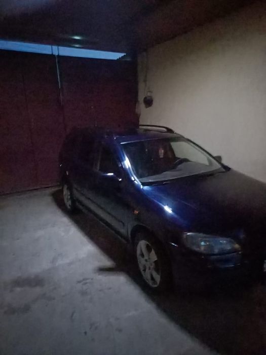 Машина Opel-Astra G
