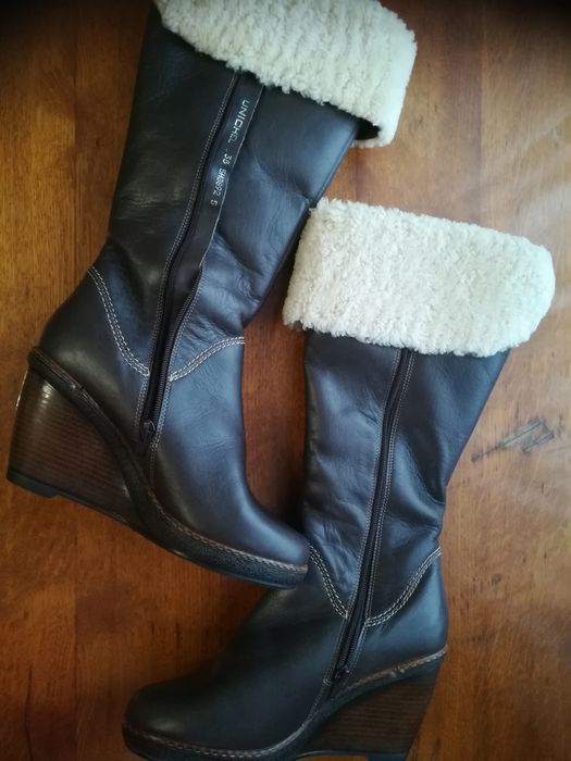 Новые кожаные сапоги