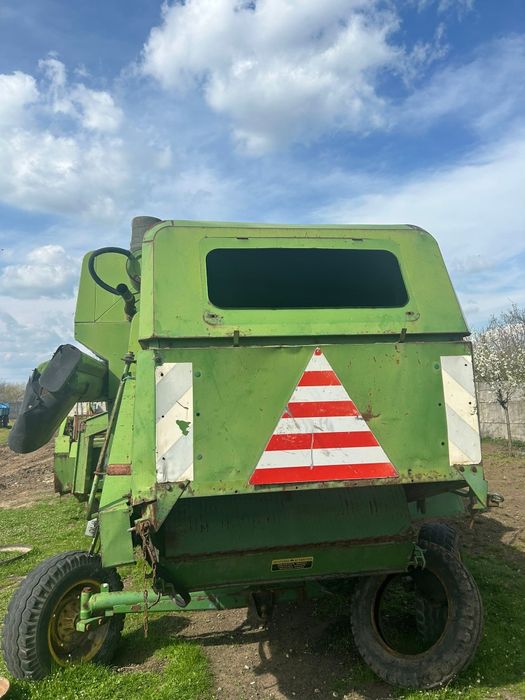 Combina John  Deer 975 cu motor defect sau odezmembrez.