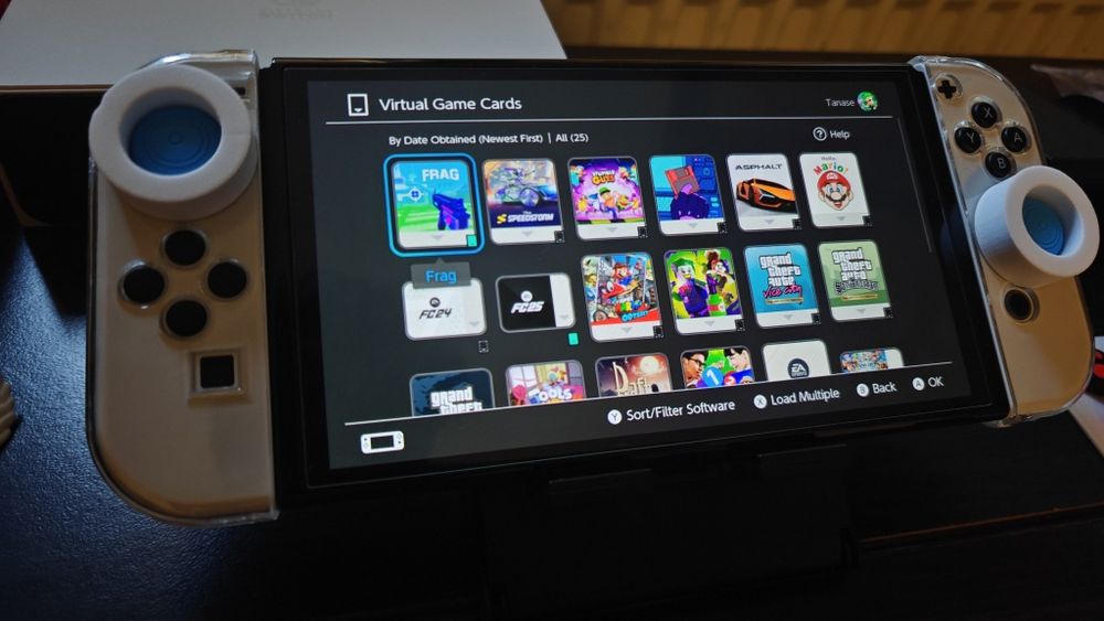 Nintendo Switch OLED (Ca Nou) + Jocuri  + accesorii