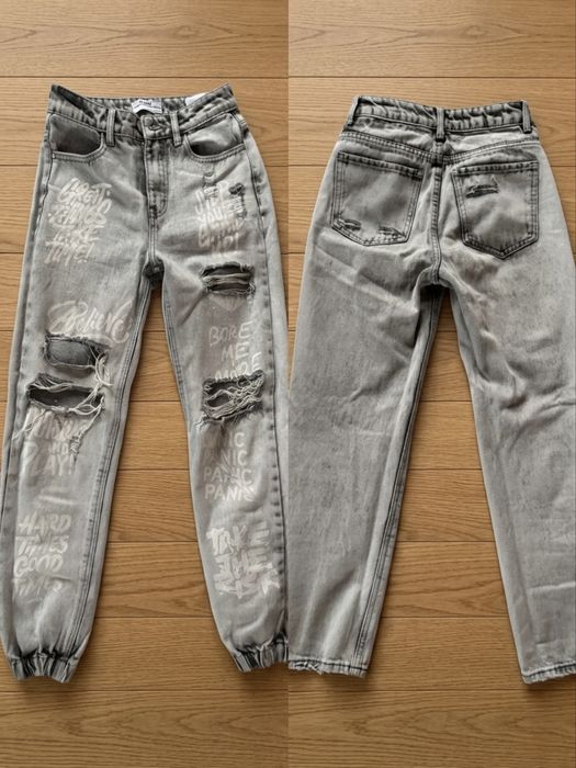 Сиви дънки с графити надписи и прорези