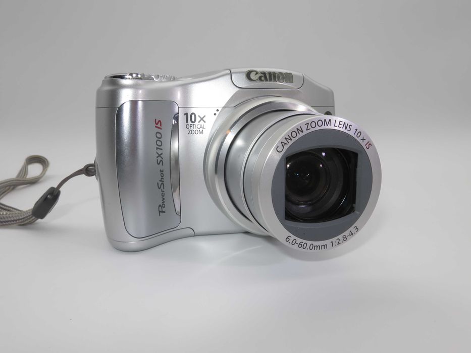 Canon PowerShot SX100 компактен цифров фотоапарат в сребърен цвят, дигитална камера в отлично състояние, 10х оптичен зум, 8MP, тестван работи супер