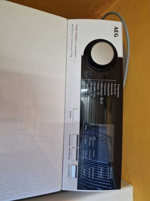 Пералня AEG с горно отваряне