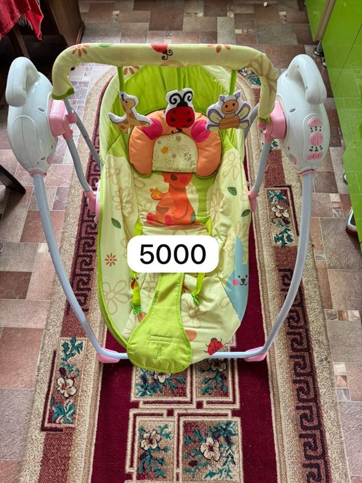 Продам детские вещи , и качелю