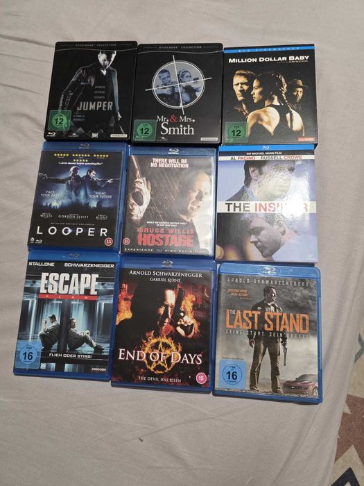Set 9 filme bluray din care 2 Steelbook si unul bookcase (Arnold Schwarzenegger, Angelina Jolie, Brad Pitt, Bruce Willis, Al Pacino, Russell Crowe)