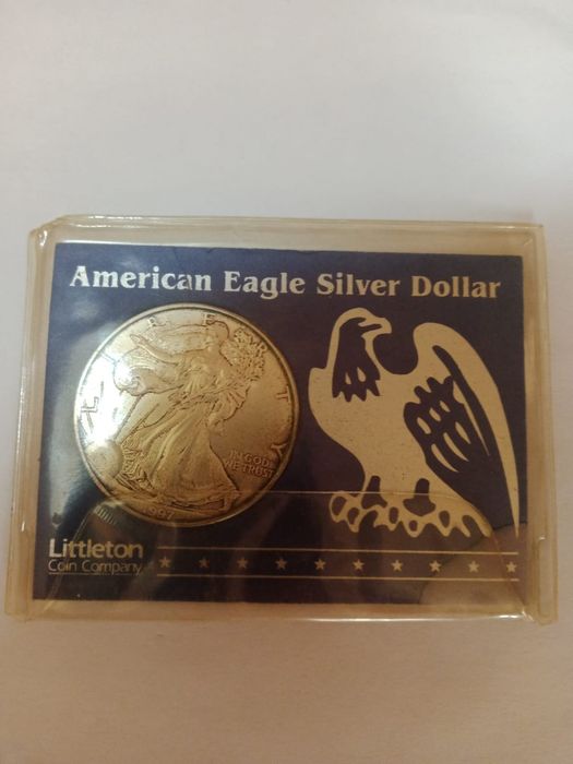 Монета доллар серебро