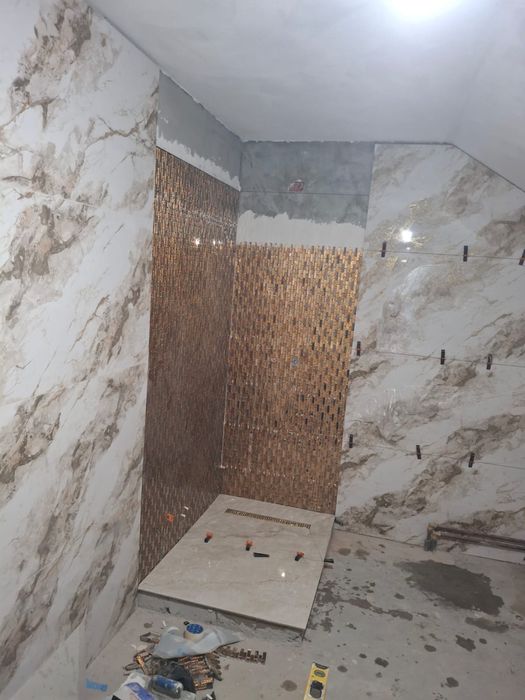 Executam lucrari de pus gresie si faianta