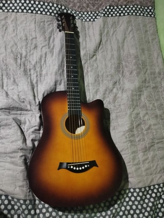 Gitara akustik mawkala yozmela