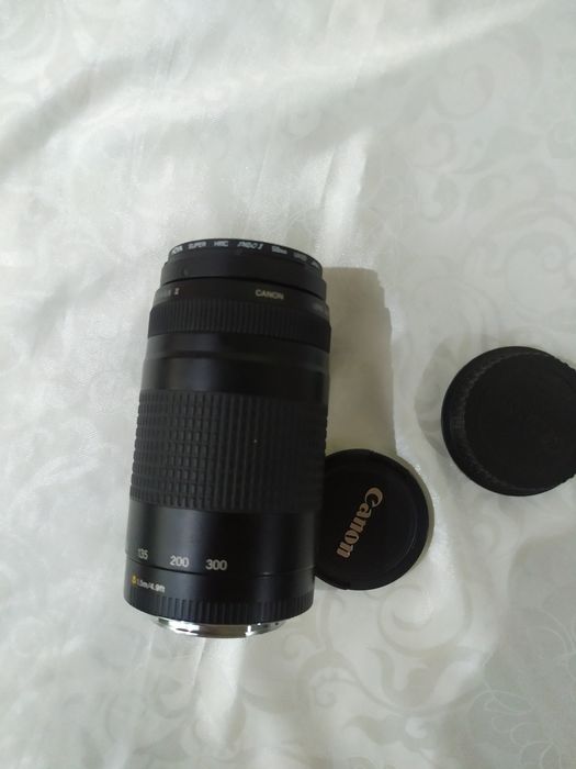 Foto aparat qoʻshimcha Binokili bilan