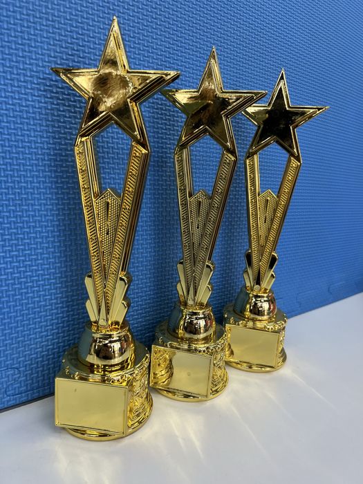 Статуэтки кубки медали награды