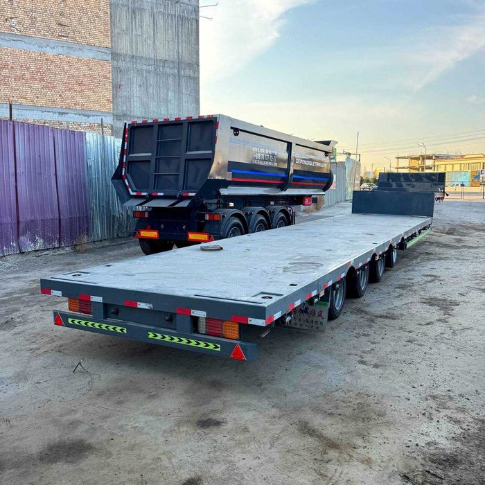 Универсальный низкорамный трейлер «IZAZ TRAILERS»