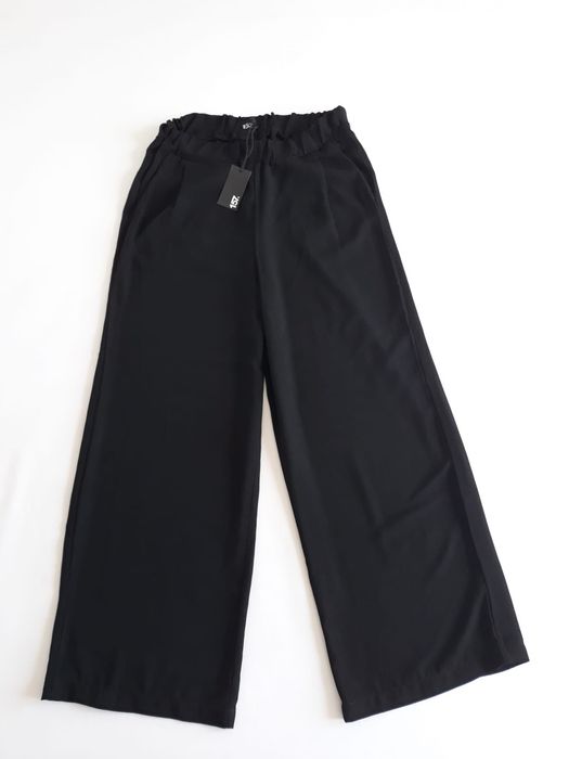 Pantaloni largi cu talie înaltă