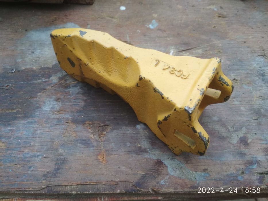 Зубы (клыки) и коронки на ковши