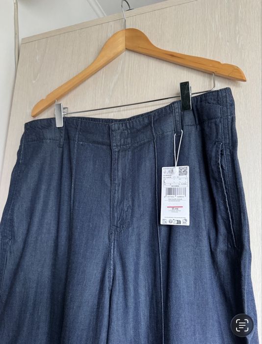 Pantaloni evazati aspect denim XL Mango