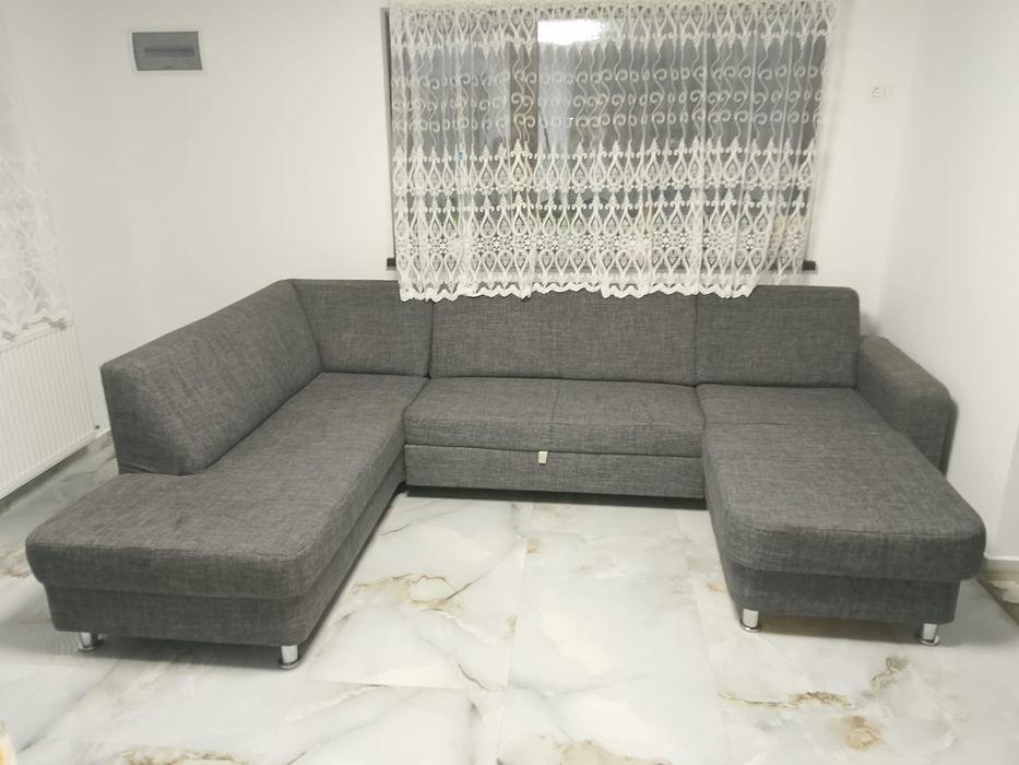 Vând colțar extensibil în forma U textil  gri. Saltea relaxa, stare foarte bună