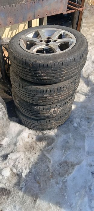 Продам 4 титановых диска с резиной (торг)