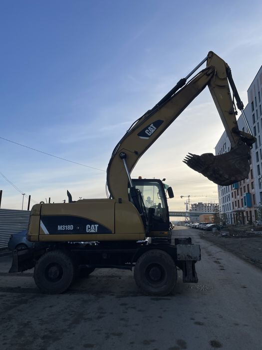 Продам колесный эксковатор CAT318